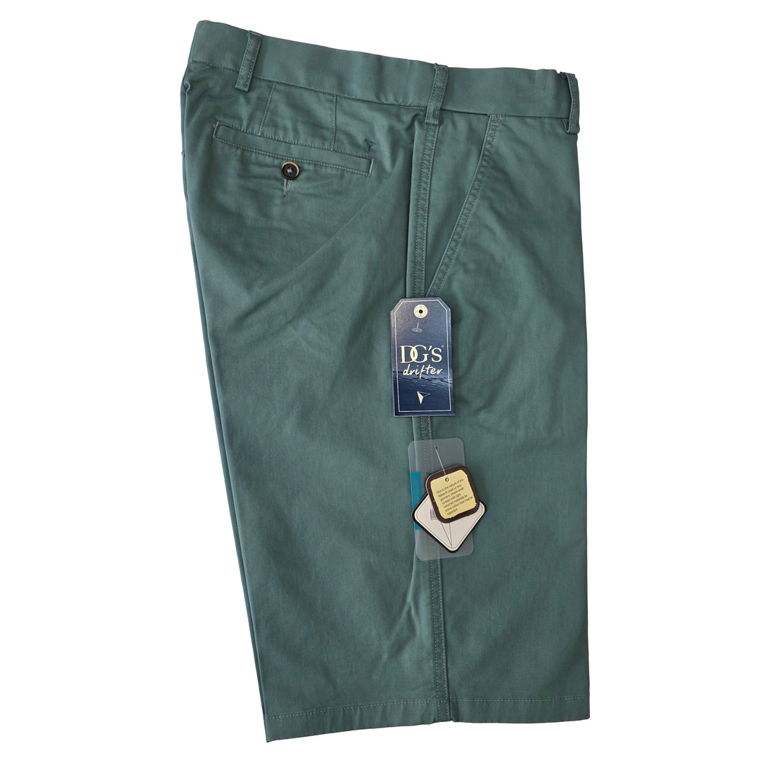 Green pants with a tag on a white background