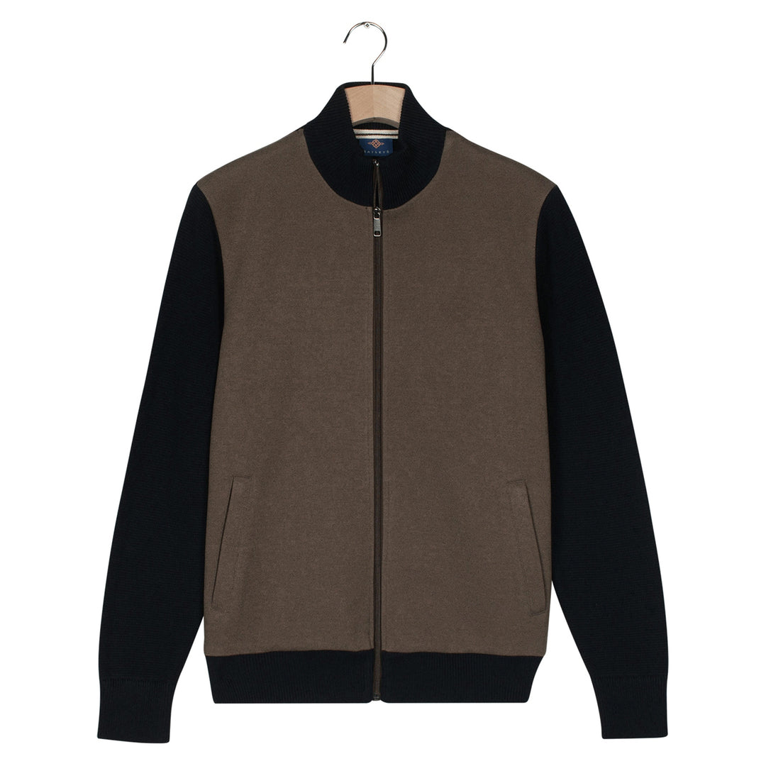 Brown and navy cardigan jacket on a hanger with a white background