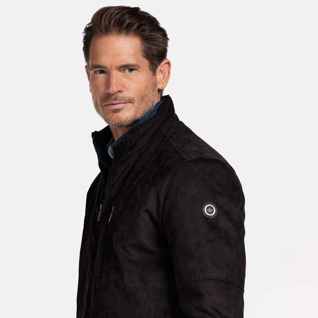 Man wearing a brown jacket on a white background