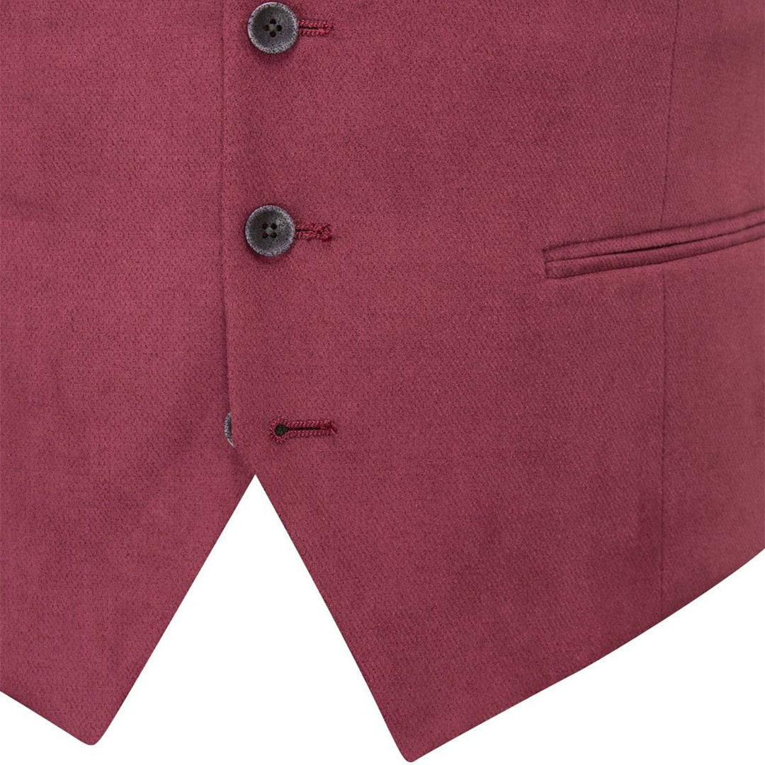 Close-up of a maroon vest with buttons and a pocket on a white background