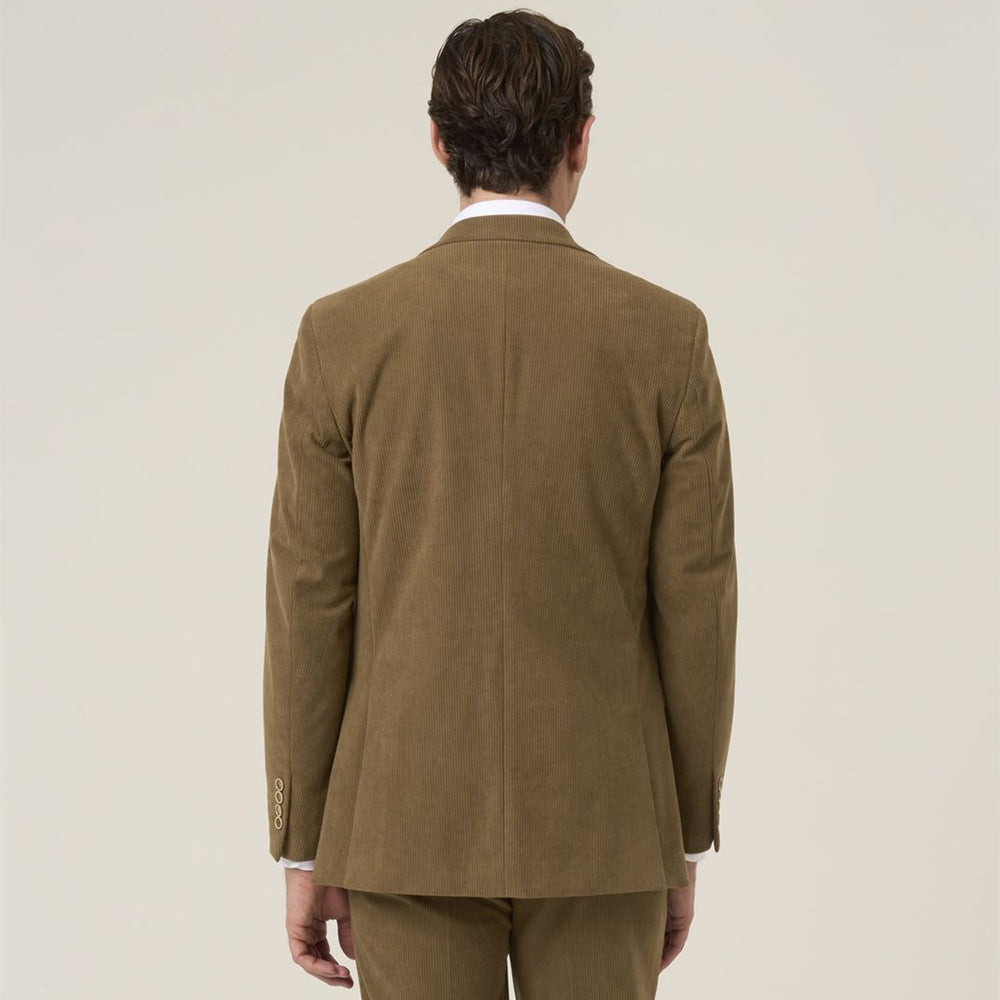 Man wearing a brown suit jacket on a plain background