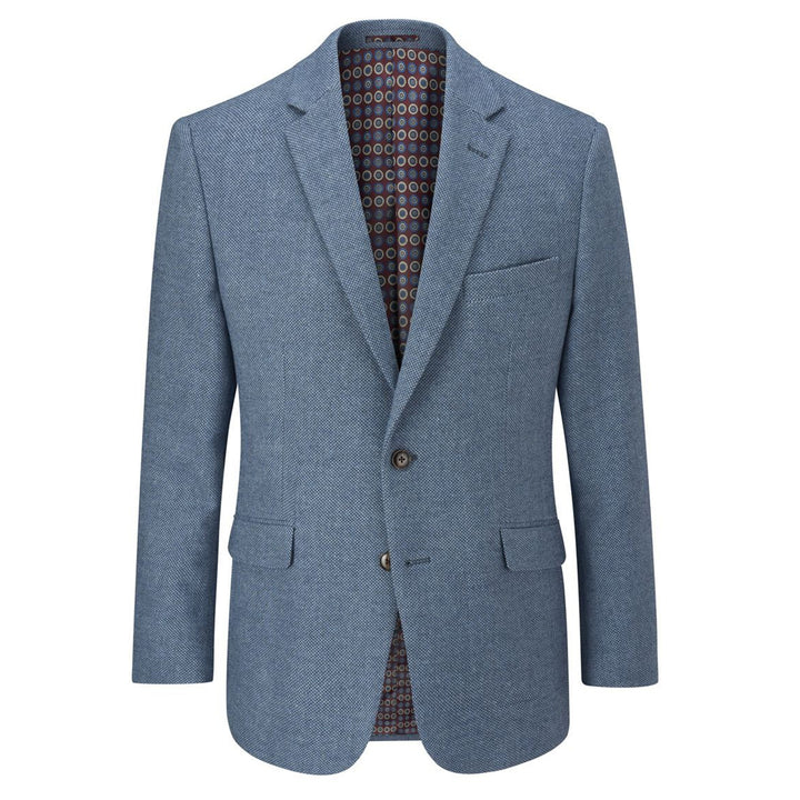 Blue blazer with a patterned shirt underneath on a white background