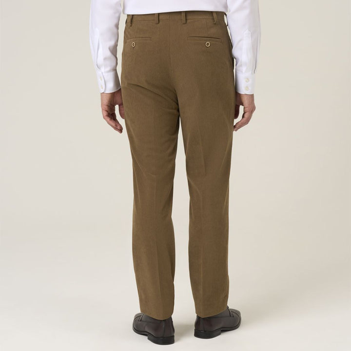 Brown pants worn by a person on a white background