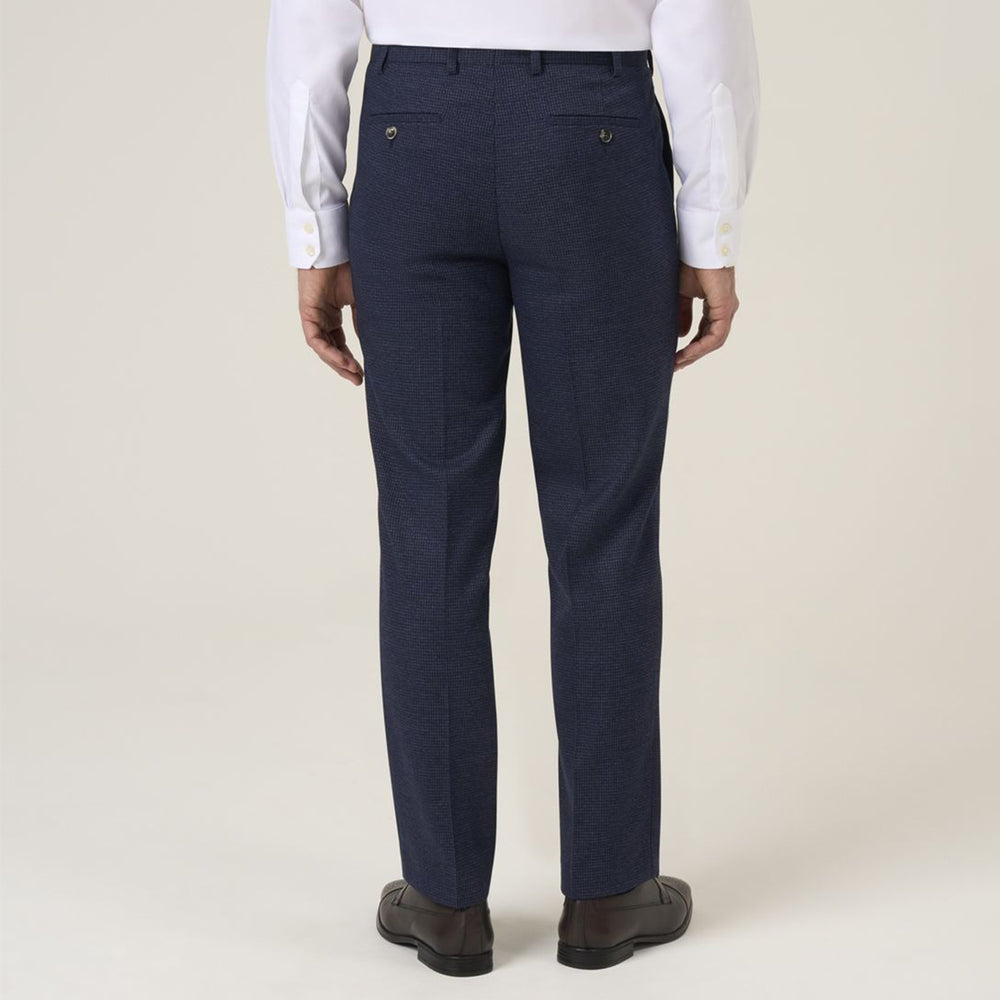 Navy blue dress pants worn by a person on a white background