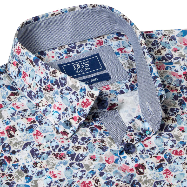 Colorful patterned shirt with a visible brand label on a white background