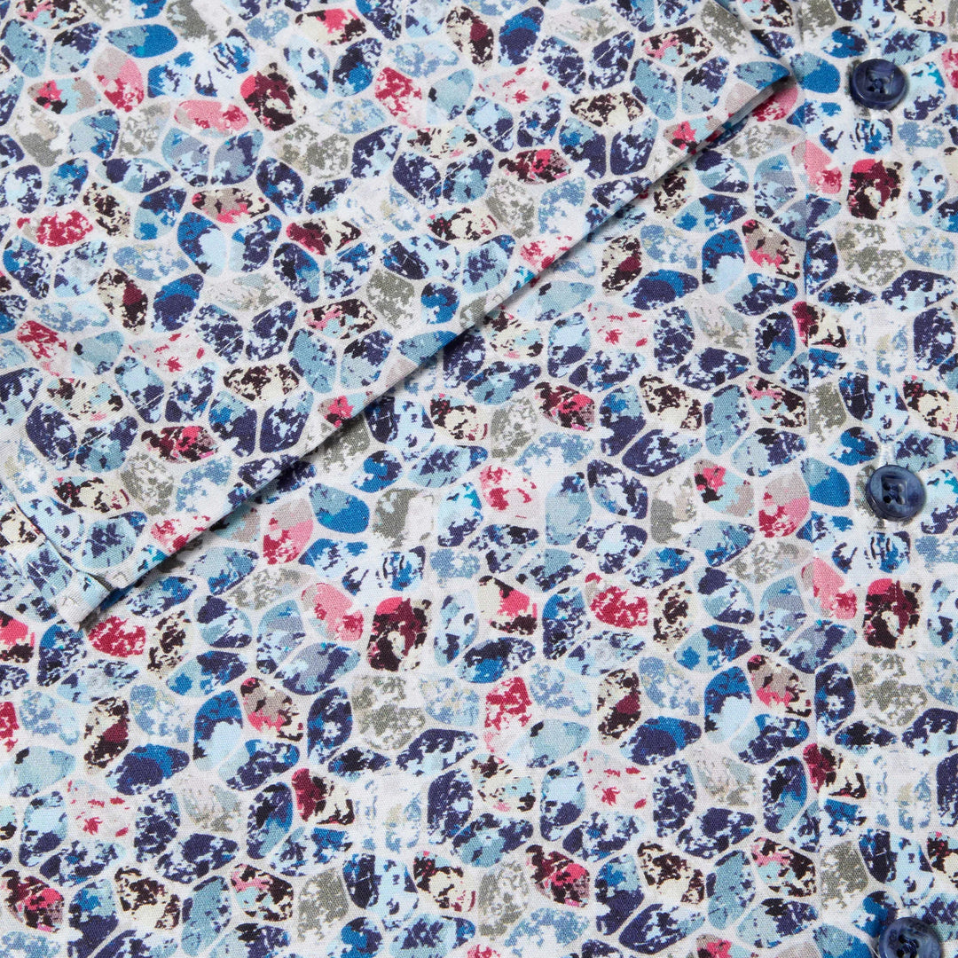 Multicolored patterned fabric with a button on a white background