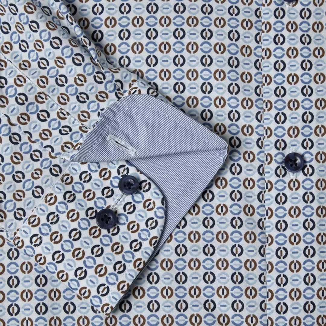 Gray baby bonnet on a patterned fabric background