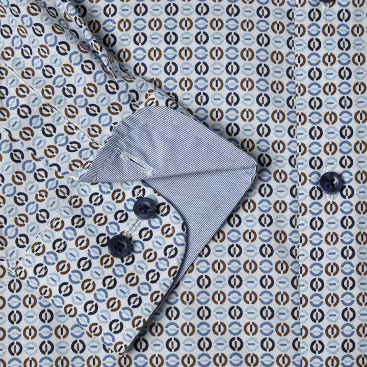 Gray baby bonnet on a patterned fabric background