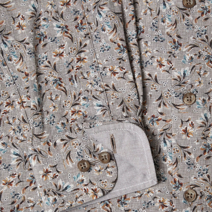 Floral patterned fabric with buttons on a gray background