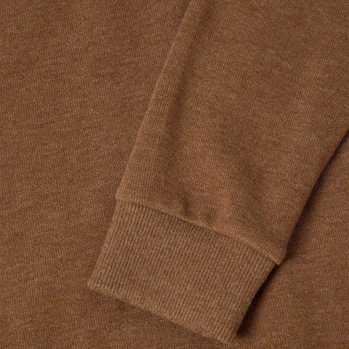 Close-up of a brown sweater with a ribbed cuff