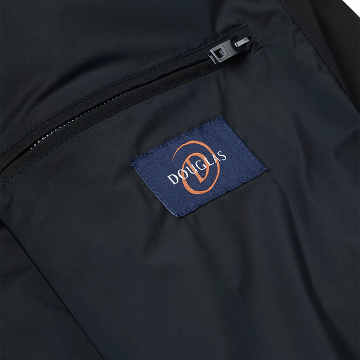 Close-up of a black jacket with a Douglas brand label.