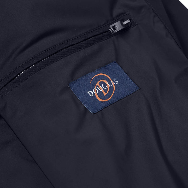 Close-up of a navy jacket with a Douglas brand label.