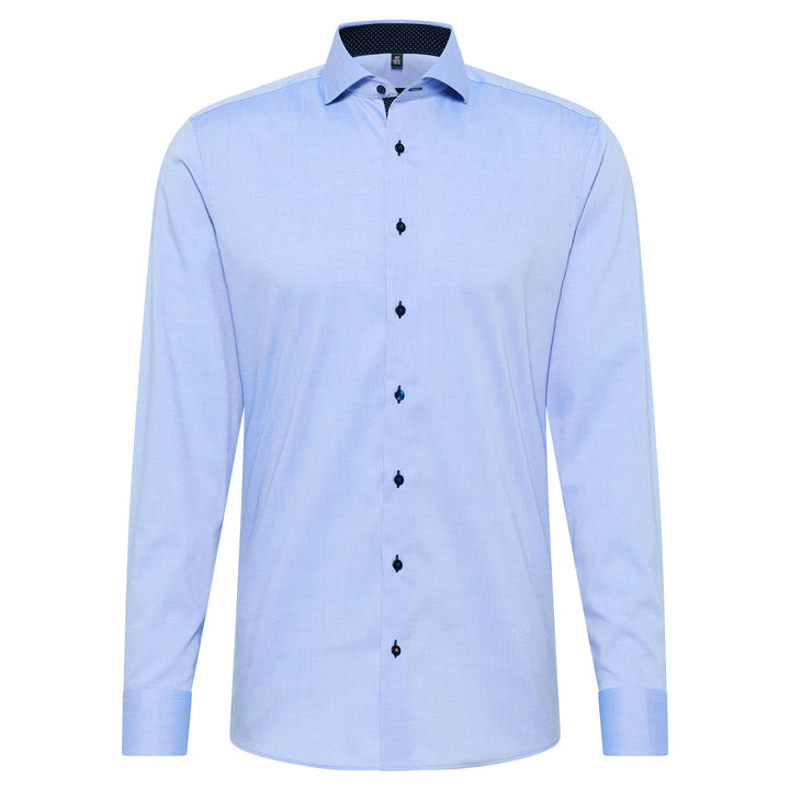 Light blue dress shirt with black buttons on a white background
