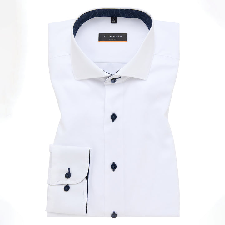 White dress shirt with black buttons and trim on a white background, featuring Eterna branding.