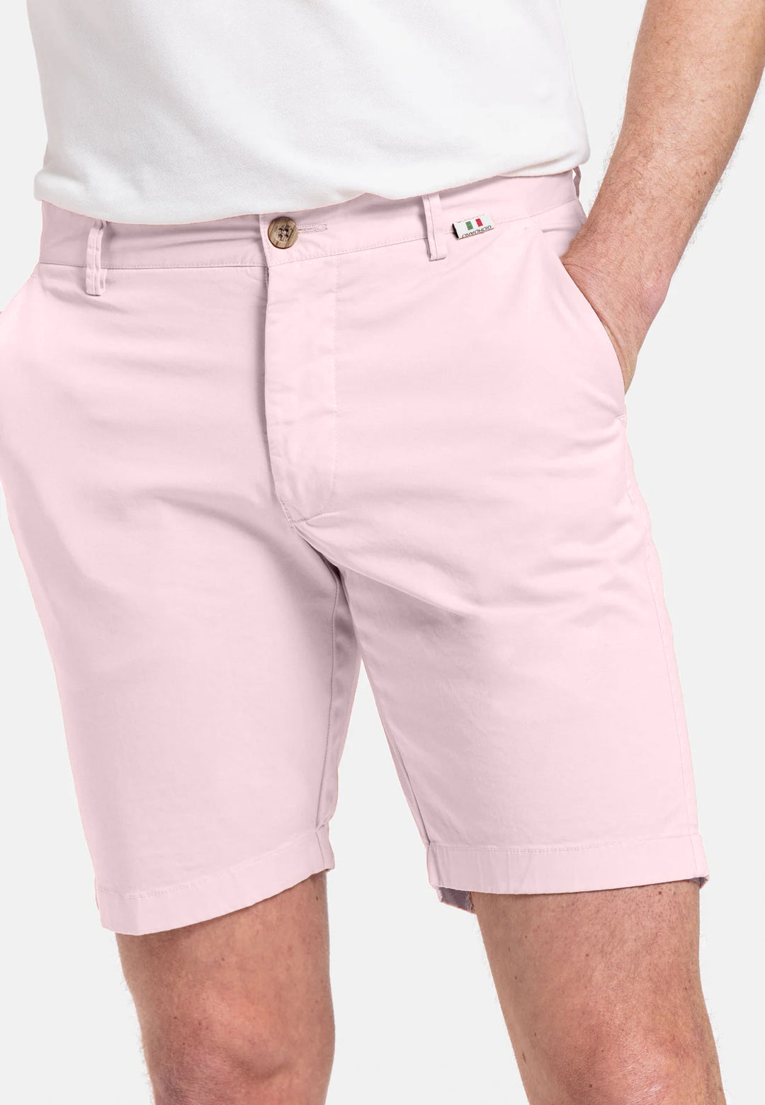 Pink shorts worn by a person on a white background