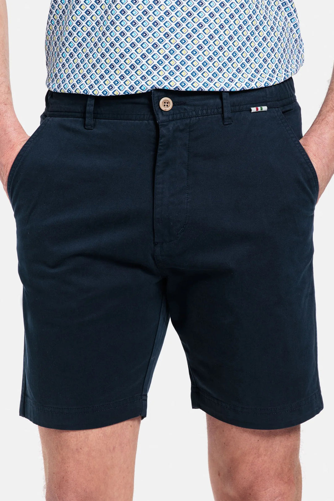 Navy shorts worn by a person on a white background