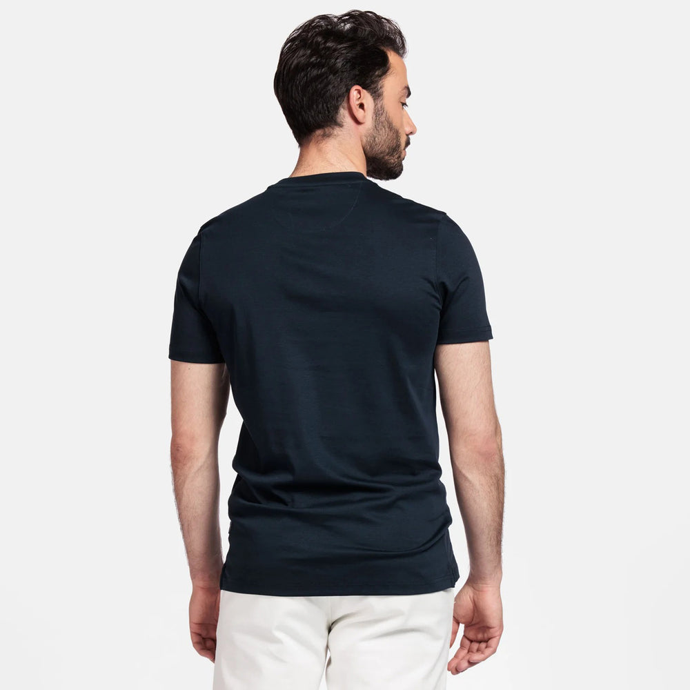 Man wearing a navy t-shirt on a white background