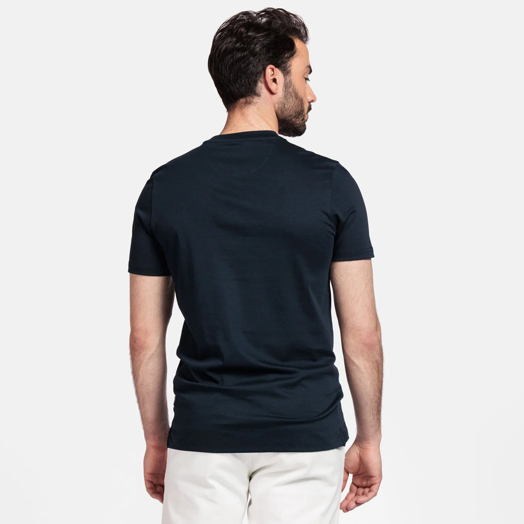 Man wearing a navy t-shirt on a white background