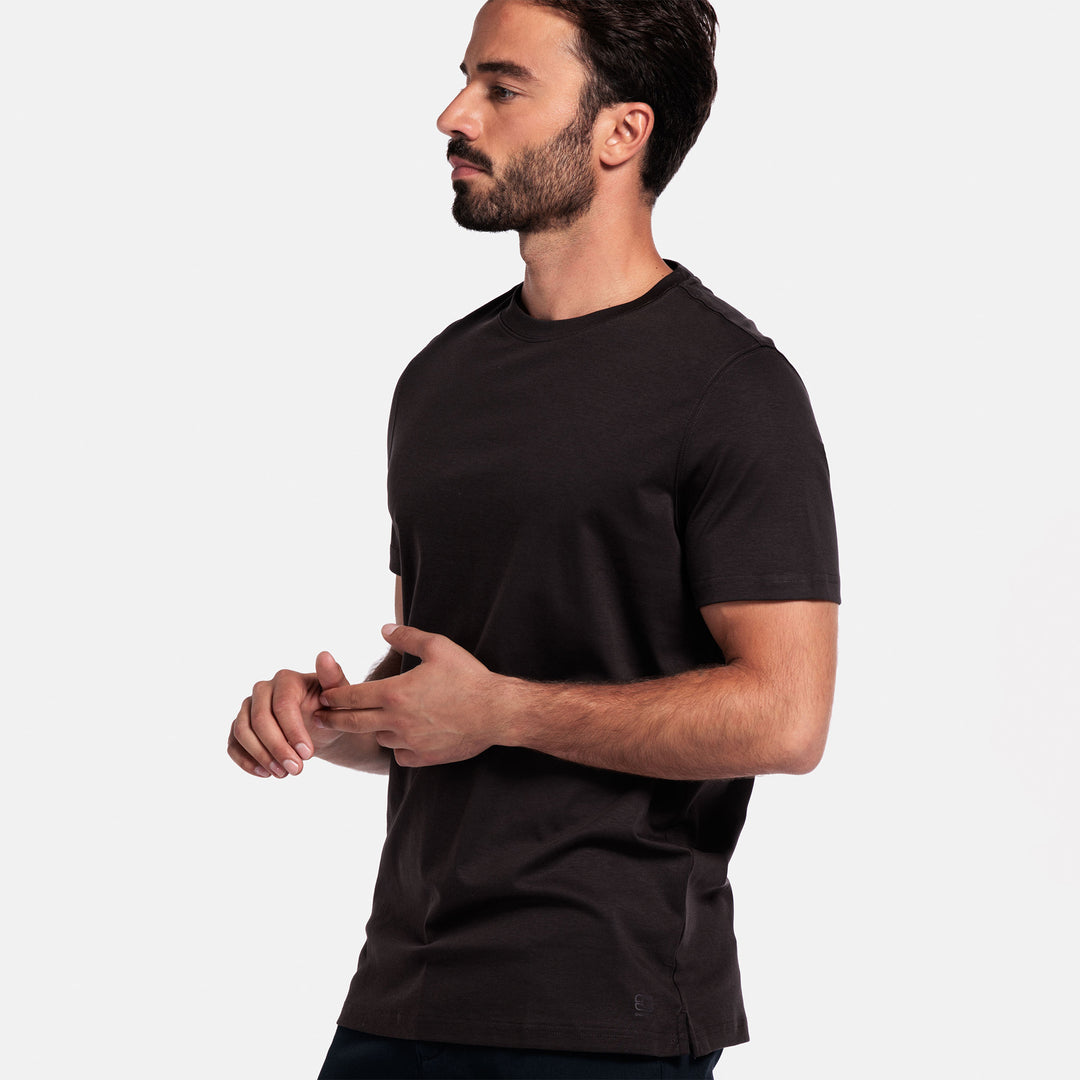 Man wearing a brown t-shirt against a plain background