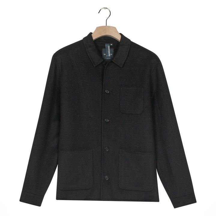 Black jacket on a hanger against a white background