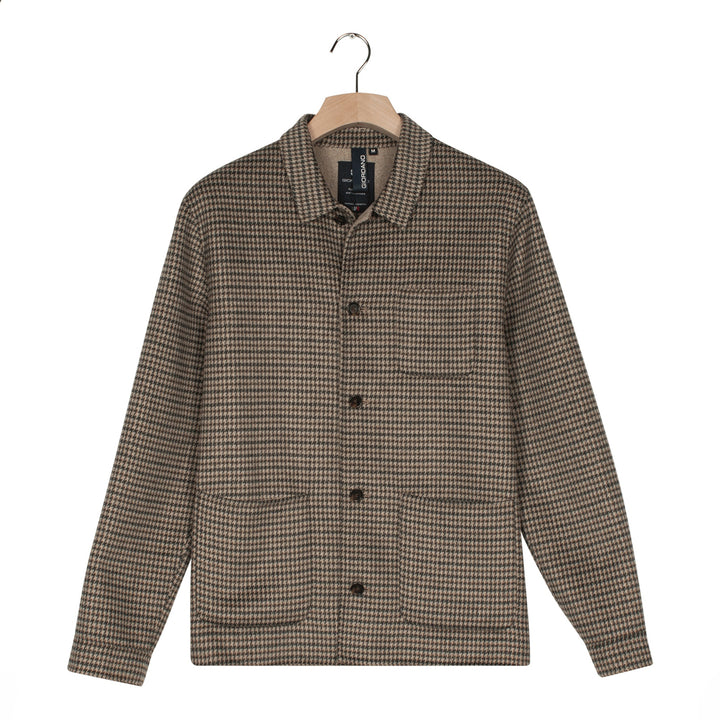 Houndstooth pattern shirt on a hanger with a white background