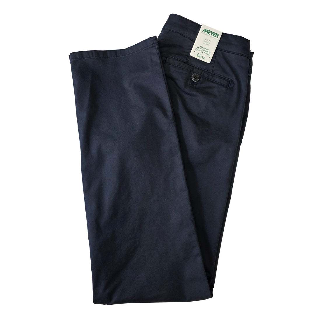 Folded navy blue pants with a tag on a white background