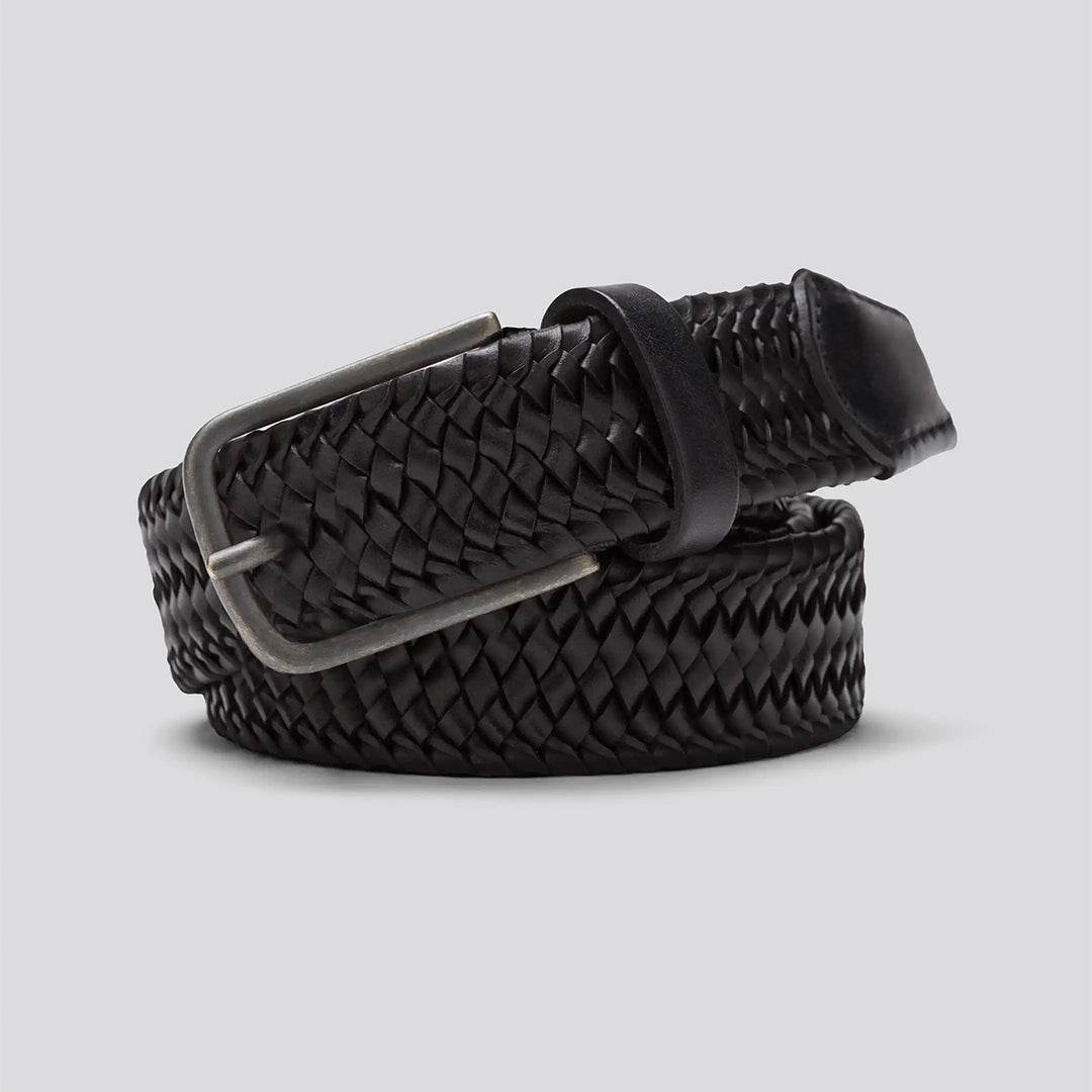 Black woven belt with a silver buckle on a light gray background