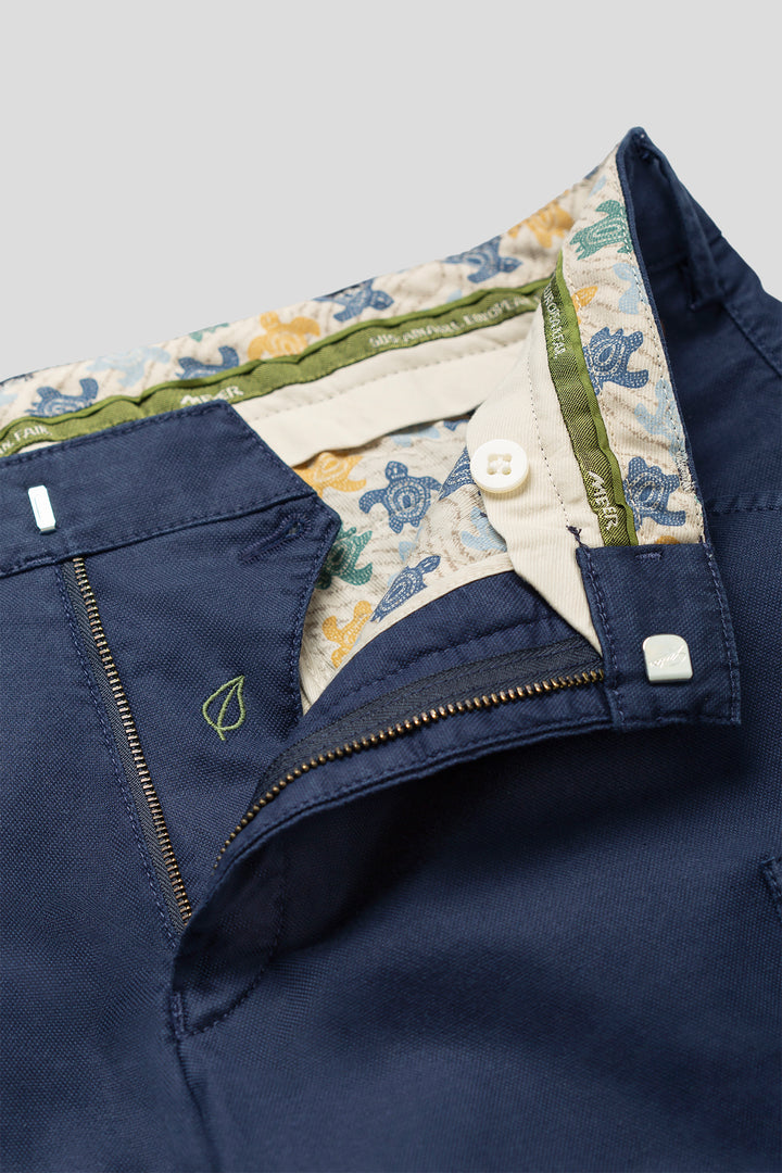 Navy blue jacket with floral lining on a gray background