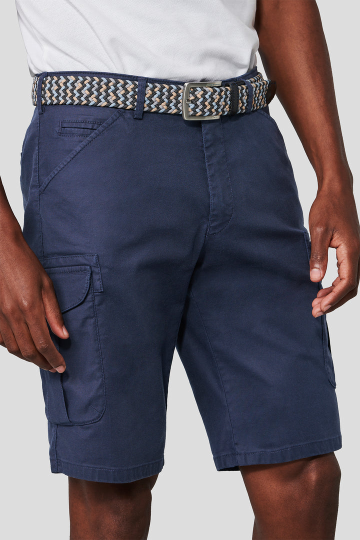 Navy cargo shorts with a belt on a plain background