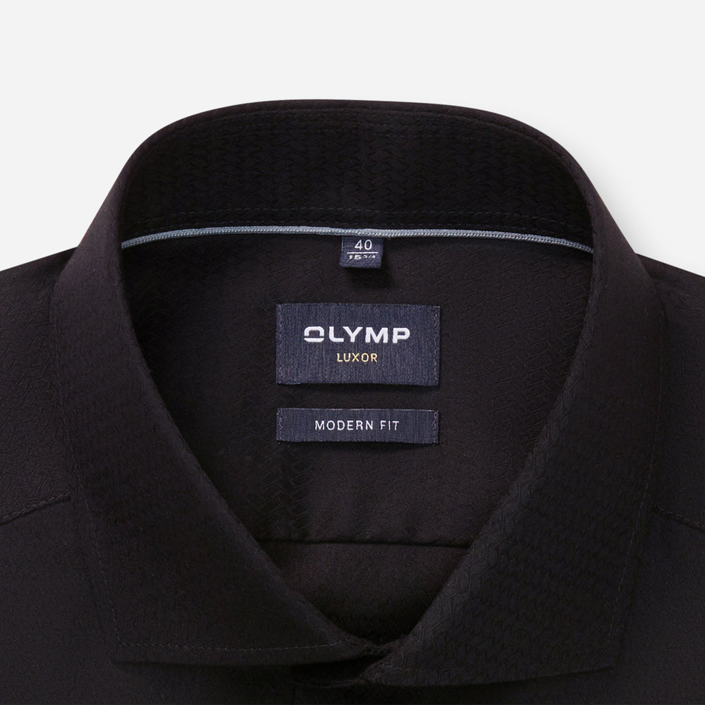 Black shirt collar with Olymp Luxor label on a white background