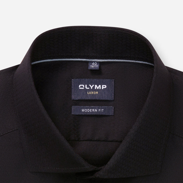 Black shirt collar with Olymp Luxor label on a white background