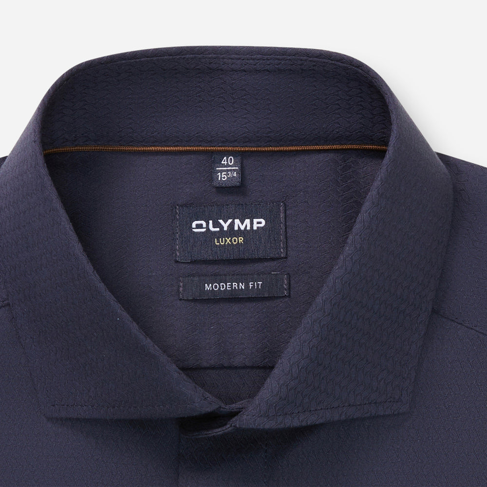 Navy shirt collar with Olympus Luxor label on a white background