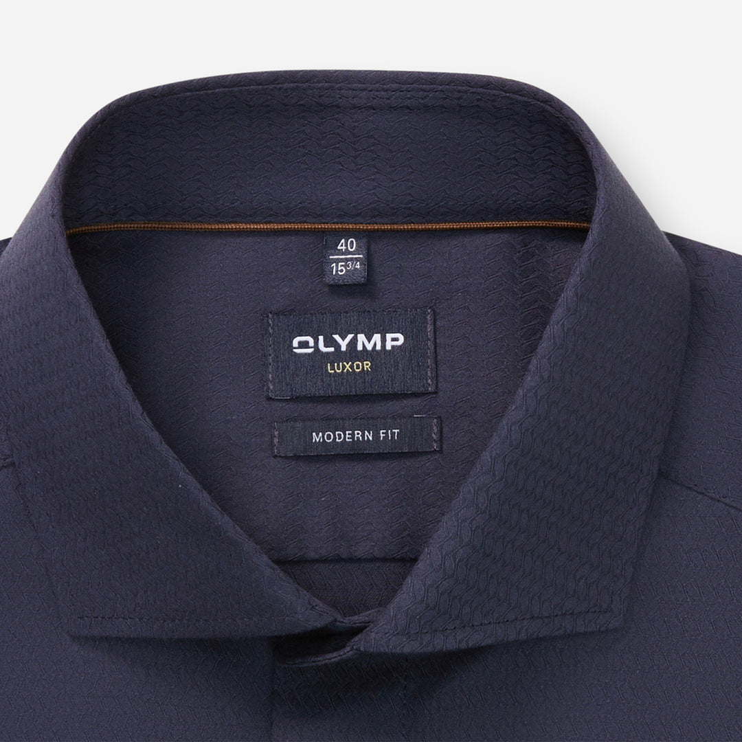 Navy shirt collar with Olympus Luxor label on a white background