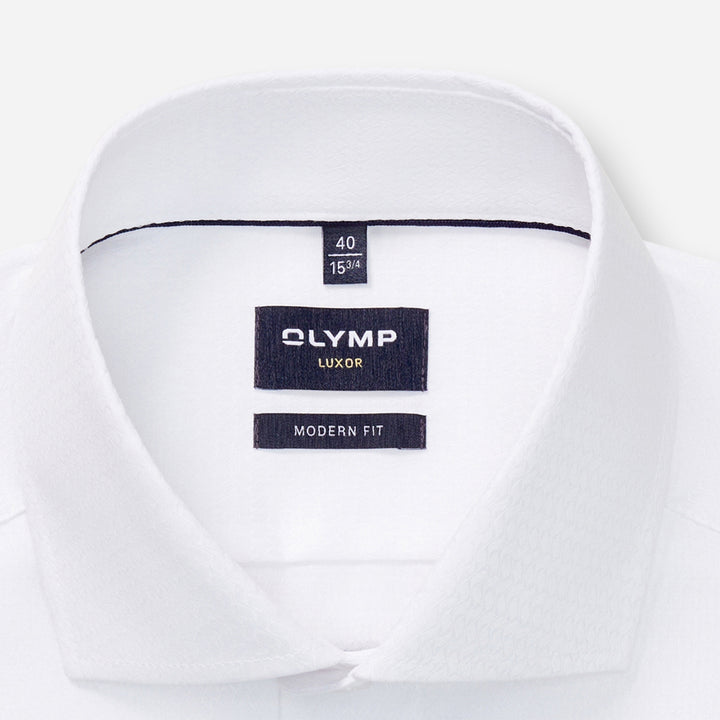 White shirt with Olympus label on a white background